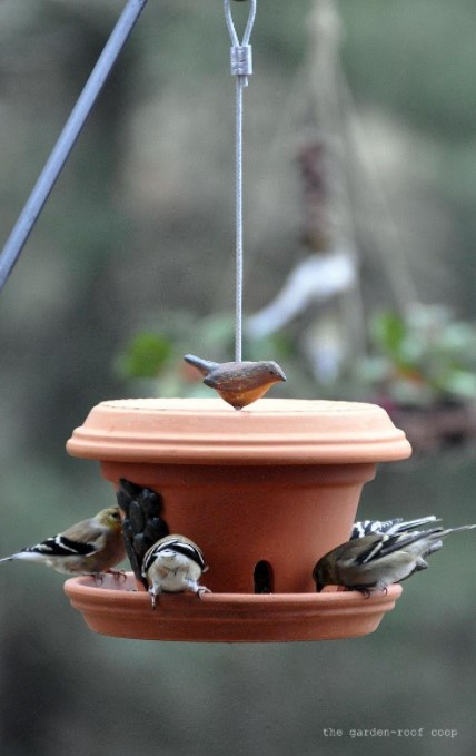 25 DIY Bird Feeder Ideas to Create a Bird-Friendly Backyard – DIY Flowerpot Bird Feeder DIY Flowerpot Bird Feeder